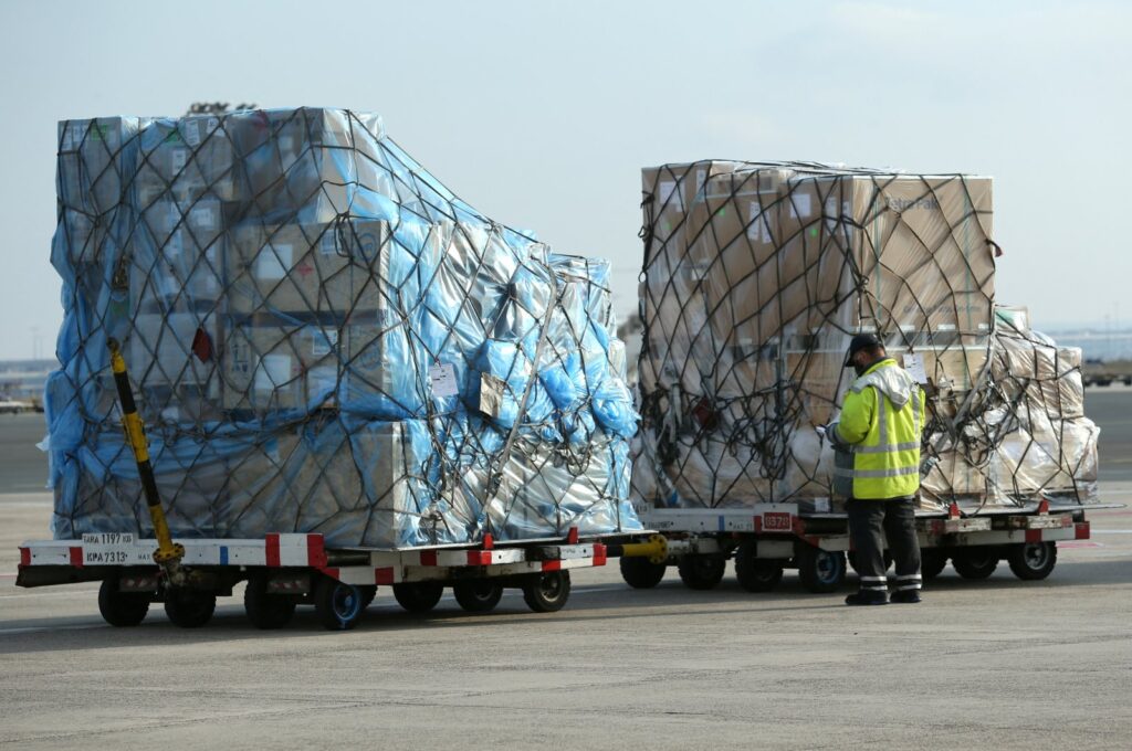 An employee checks freight at a ramp of Frankfurt airport, Germany, Nov. 27, 2020. (Reuters Photo)