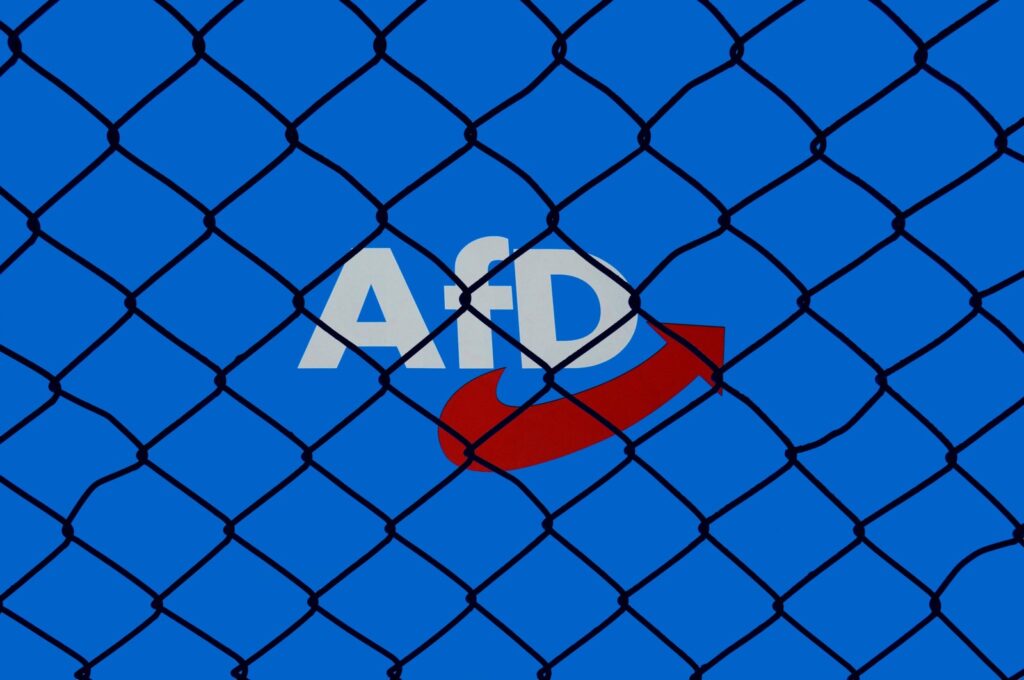 An AfD logo is behind wire mesh in Borkwalde, Brandenburg, Jan. 29, 2024. (Reuters Photo)