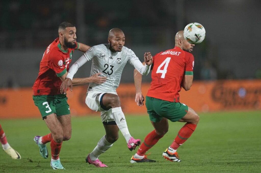 Morocco's Noussair Mazraoui (L) and South Africa's Thapelo James Morena (C) battle for the ball during the AFCON round of 16 match at Stade Laurent Pokou, San-Pedro, Ivory Coast, Jan. 30, 2024. (Getty Images Photo)