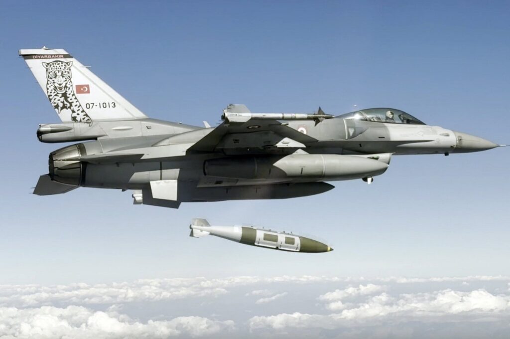 This handout photo from the National Defense Ministry shows a Turkish military jet dropping a missile on PKK targets in the Metina and Gara regions of northern Iraq, Jan. 14, 2024. (AA Photo)