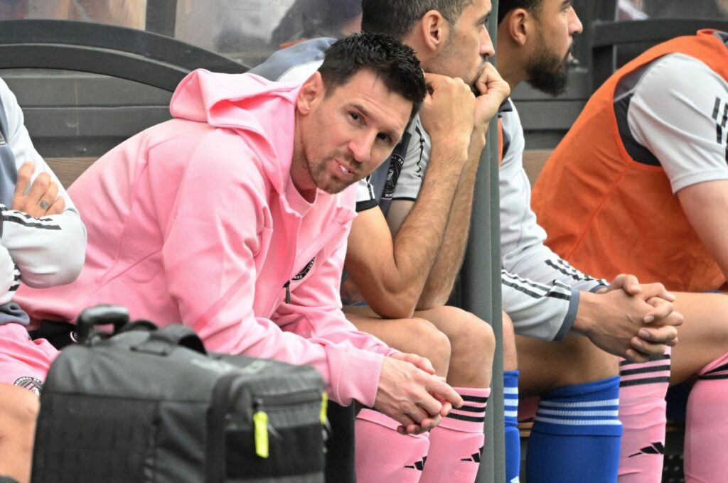 Inter Miami's Lionel Messi (L) sits on the bench during the friendly football match between Hong Kong XI and U.S. Inter Miami CF, Hong Kong, Feb. 4, 2024. (AFP Photo)