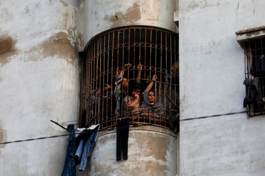 Residents watch an election campaign rally in Karachi, Pakistan, Feb. 5, 2024. (Reuters Photo)