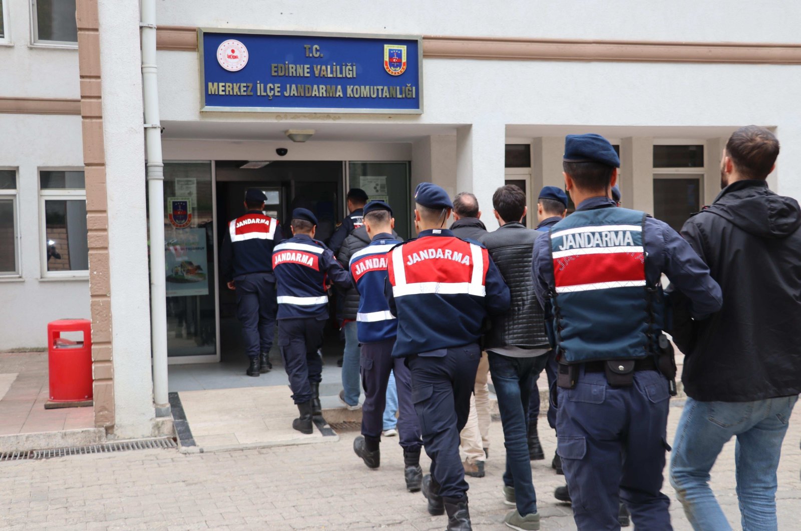 Gendarmerie officers escort 9 FETÖ suspects captured while fleeing Türkiye, Edirne, northwestern Türkiye, Feb. 5, 2024. (AA Photo)