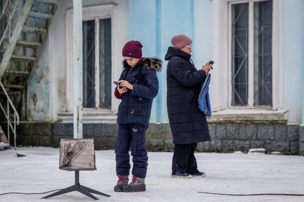 Local residents use a Starlink terminal amid Russia's attack on Ukraine, in Chasiv Yar, Donetsk region, Ukraine, Jan. 31, 2023. (Reuters Photo)