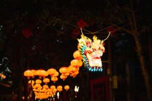 Chinese officials bet on Lunar New Year festivities to boost the economy amid Year of the Dragon celebrations, as migrant workers journey home in adherence to tradition. (Getty Images Photo)
