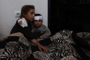 Wounded Palestinian girl Somay al-Najar (L) comforts her brother Yamen following Israeli bombardments over Rafah, southern Gaza Strip, Palestine, Feb. 12, 2024. (AFP Photo)