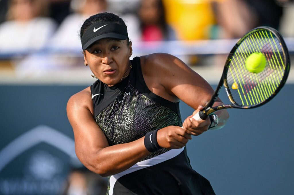 Japan's Naomi Osaka hits a return against Danielle Collins of the U.S. during the women's singles match at the Mubadala Abu Dhabi Open, Abu Dhabi, UAE, Feb. 6, 2024. (AFP Photo)
