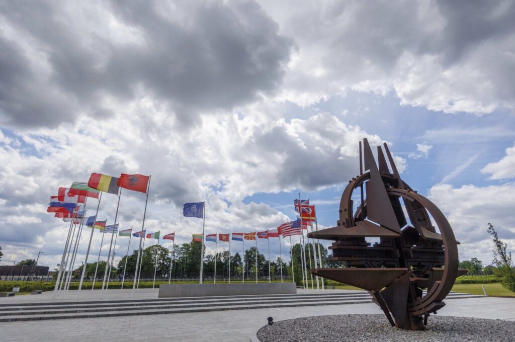 Flags of NATO member countries flap in the wind outside NATO headquarters in Brussels, Belgium, May 25, 2022. (AP Photo)
