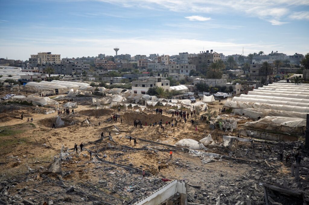 People inspect a destroyed area following an Israeli airstrike on the Rafah refugee camp, the Gaza Strip, Palestine, Feb. 12, 2024. (EPA Photo)