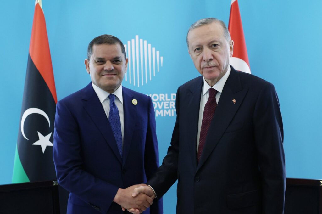 President Recep Tayyip Erdoğan (R) shakes hands with Prime Minister Abdul Hamid Dbeibah, the head of the Tripoli-based Government of National Unity (GNU), on the sidelines of the World Governments Summit in Dubai, United Arab Emirates (UAE), Feb. 13, 2024. (AA Photo)