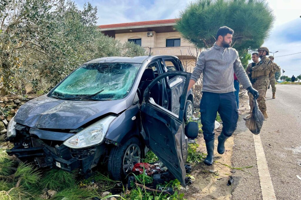 Lebanese army soldiers secure the area around a vehicle targeted in an Israeli drone attack in the town of Bint Jbeil, southern Lebanon, Feb. 12, 2024. (AFP Photo)