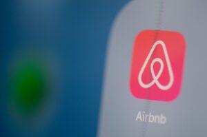 This illustration shows the logo of the U.S. online booking homes application Airbnb on the screen of a tablet, Paris, France, July 24, 2019. (AFP Photo)