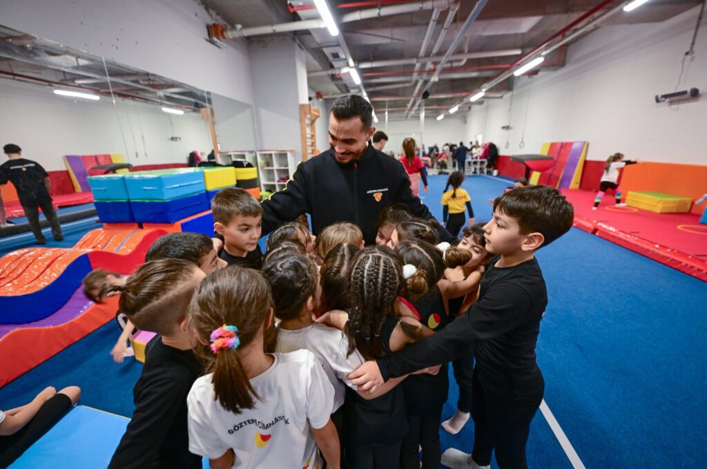 Turkish gymnast Ferhat Arıcan plays with the children at the Göztepe Gymnastics Academy, Istanbul, Türkiye, Feb. 14, 2024. (AA Photo)