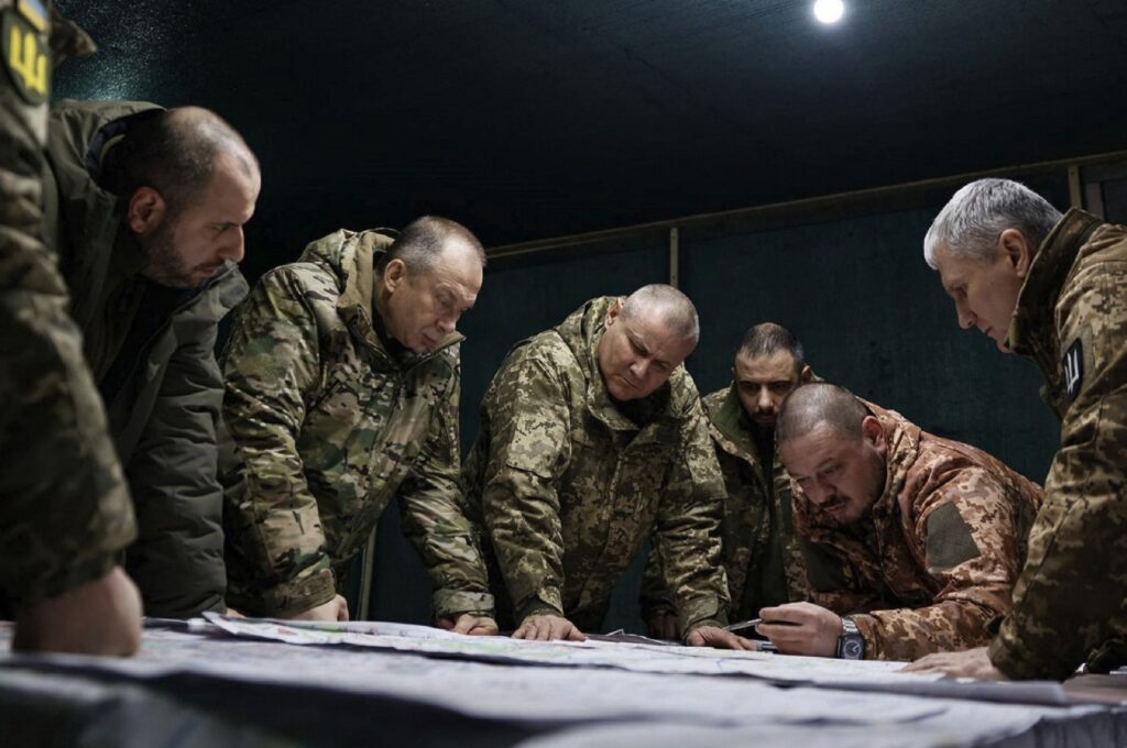 Ukraine's Commander-in-Chief of the Armed Forces Oleksandr Syrsky (2nd L) and Ukraine's Defence Minister Rustem Umerov (L) visit the frontline positions at an undisclosed location in eastern Ukraine, Feb. 14, 2024.