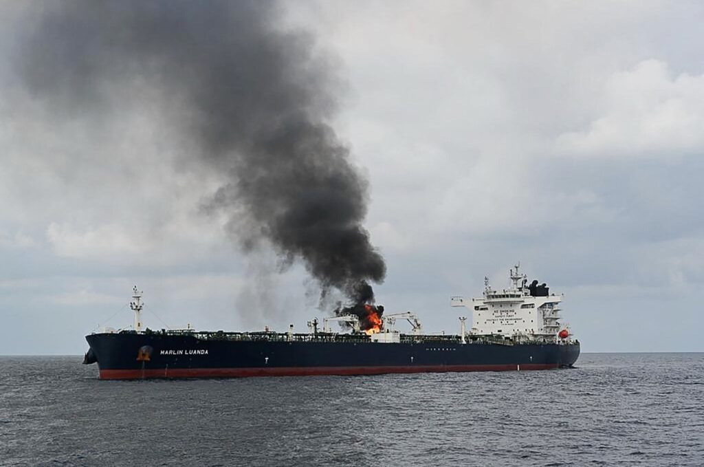 Smoke billowing from the British oil tanker MV Merlin Luanda after the Indian Navy deployed the INS Visakhapatnam following a distress call by the vessel while transiting through the Gulf of Aden in the Arabian Sea, Jan. 27, 2024. (AFP Photo/Indian Ministry of Defense)