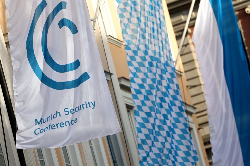 A flag carrying the logo of the 60th Munich Security Conference (MSC) flies in front of a hotel, Munich, Germany, Feb. 15, 2024. (EPA Photo)