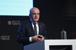 Treasury and Finance Minister Mehmet Şimşek delivers a speech during the Türkiye-Saudi Arabia Investment and Business Forum, in Istanbul, Türkiye, Feb. 16, 2024. (AA Photo)