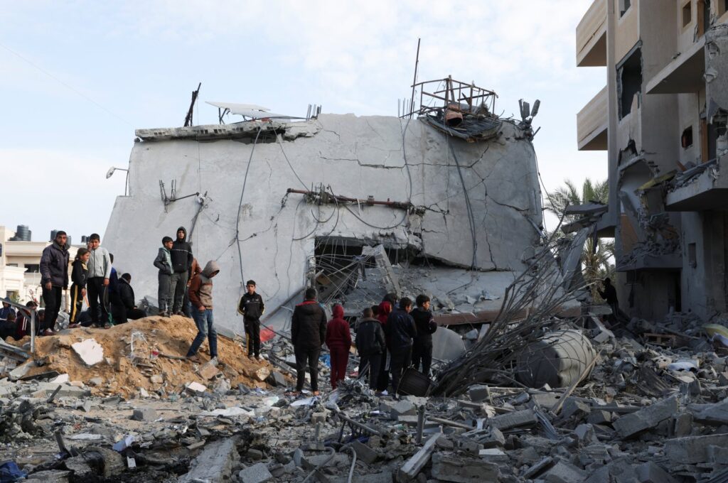 People gather near a house hit by an Israeli strike, Rafah, Palestine, Feb. 16, 2024. (Reuters Photo)