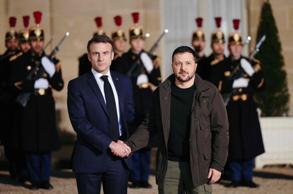 France's President Emmanuel Macron (L) shakes hands with Ukraine's President Volodymyr Zelenskyy (R) upon his arrival at the presidential Elysee palace in Paris, Feb. 16, 2024. (AFP Photo)