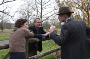 This image released by Universal Pictures shows actor Emily Blunt (L), with writer-director-producer Christopher Nolan, center, and actor Cillian Murphy on the set of "Oppenheimer." (AP Photo)