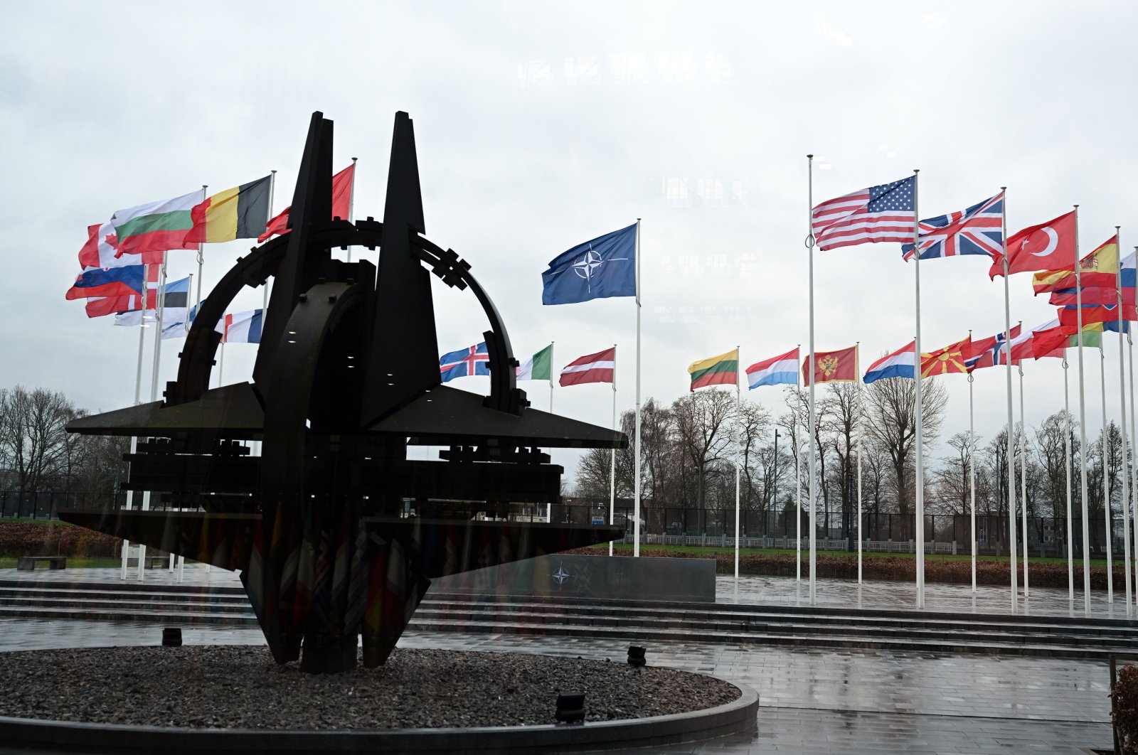 Flags of NATO and its members outside the bloc's headquarters, Brussels, Belgium, Feb. 17, 2024. (AA Photo)