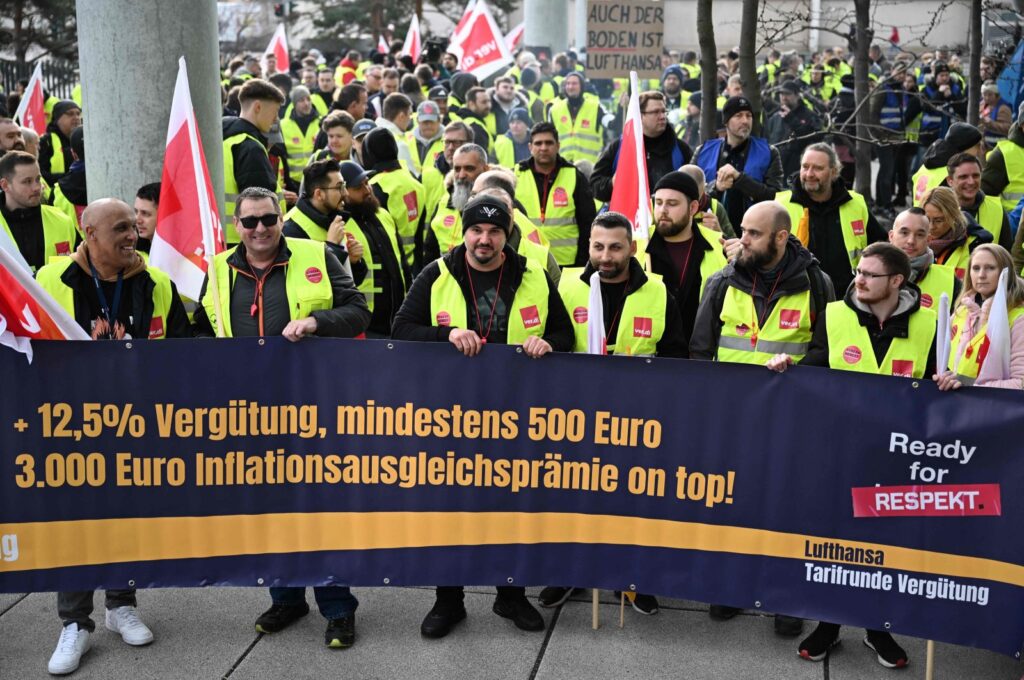 Employees of German airline Lufthansa protest with a banner reading "Ready for respect," demanding higher wages and inflation compensation, outside Frankfurt Airport, Frankfurt, Germany, Feb. 20, 2024. (AFP Photo)