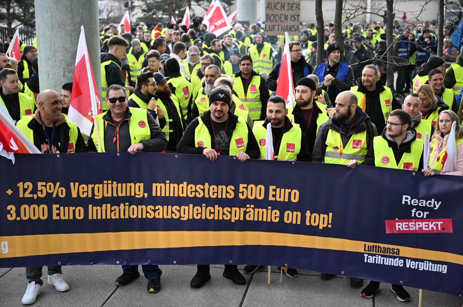 Employees of German airline Lufthansa protest with a banner reading "Ready for respect," demanding higher wages and inflation compensation, outside Frankfurt Airport, Frankfurt, Germany, Feb. 20, 2024. (AFP Photo)