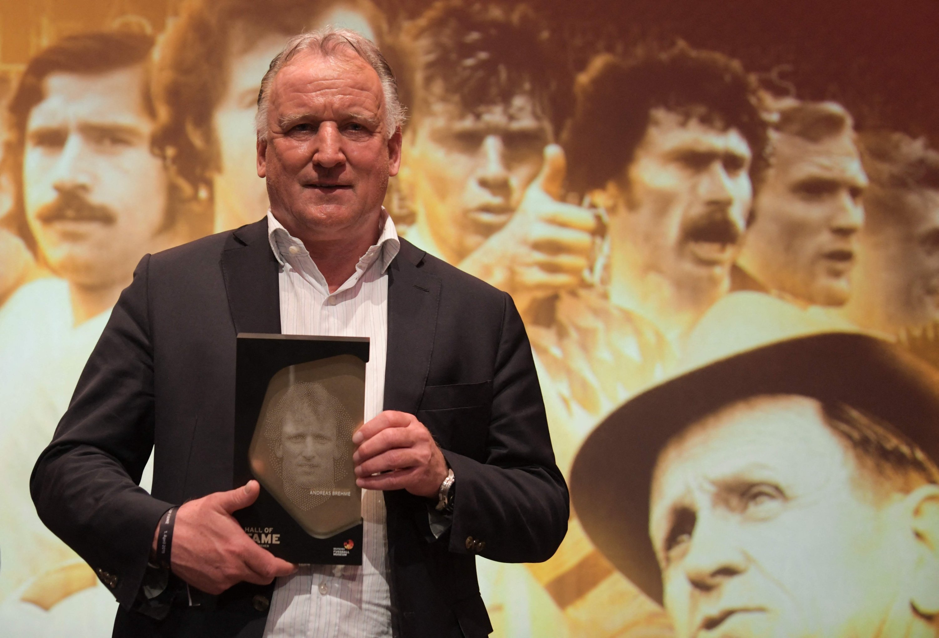 315850 The late German football player Andreas Brehme holds his trophy as he attends the opening gala for the Hall of Fame of German Football at the German Football Museum, Dortmund, Germany, April 1, 2019. (AFP Photo)