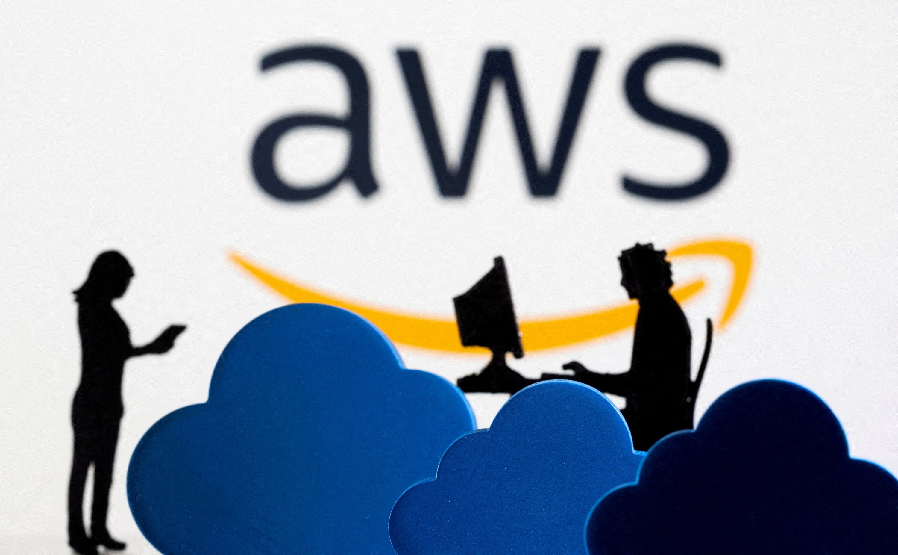 316390 3D printed clouds and figurines are seen in front of the Amazon Web Service cloud service logo in this illustration taken Feb. 8, 2022. (Reuters Photo)