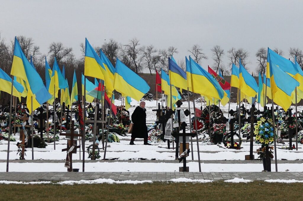 An elderly woman walks among the graves along the Alley of Heroes where Ukrainian soldiers who died in the Russian-Ukrainian war are buried, in Kramatorsk, Donetsk region, Ukraine, Feb. 22, 2024. (AFP Photo)