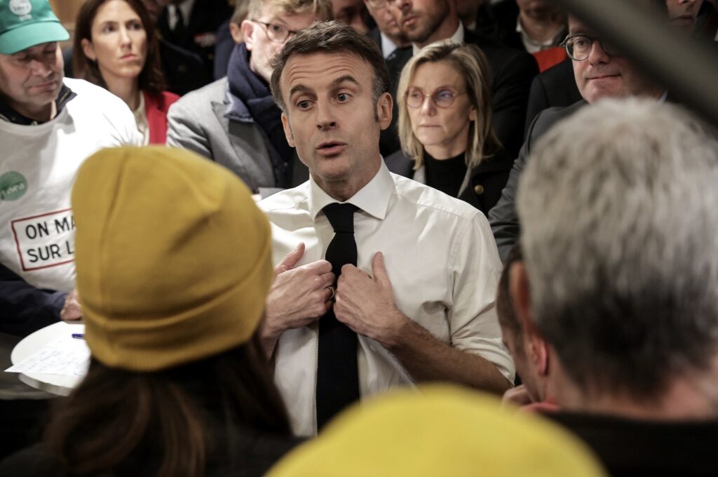 French President Emmanuel Macron (Center) gestures as he speaks with members of the agricultural unions National Federation of Agricultural Holders' Unions (FNSEA), Young Farmers (JA), Rural Coordination (CR) during the opening day of the 60th International Agriculture Fair (Salon de l'Agriculture), in Paris, France, Feb. 24, 2024. (EPA Photo)