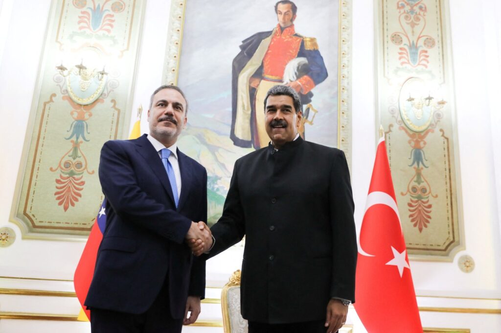 Foreign Minister Hakan Fidan and Venezuela's President Nicolas Maduro shake hands, in Caracas, Venezuela Feb. 23, 2024. (Miraflores Palace/Handout via Reuters)