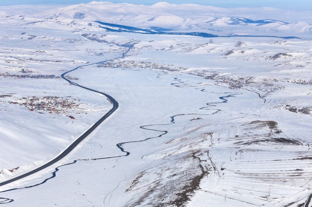 An aerial view of Ölçek Creek blanketed with snow, flowing between Kars and Ardahan, eastern Türkiye, Feb. 19, 2024. (AA Photo)