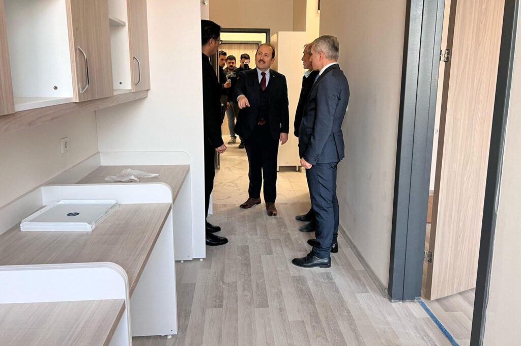 Mersin Governor Ali Hamza Pehlivan (C), alongside other officials, inspects the dorm built in the Çiflikköy Campus of Mersin University, Mersin, southern Türkiye, Feb. 25, 2024. (IHA Photo)