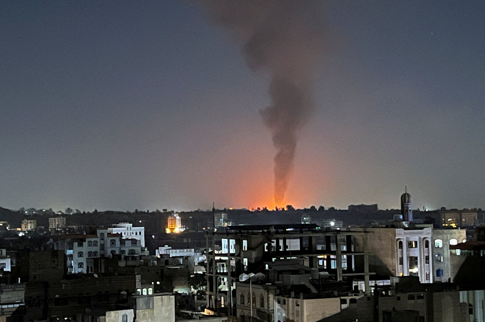 Smoke rises in the sky following U.S.-led airstrikes in Sanaa, Yemen, Feb. 25, 2024. (Reuters Photo)
