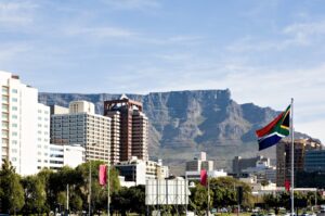 The Table Mountain rises behind downtown Cape Town, South Africa. (Getty Images Photo)