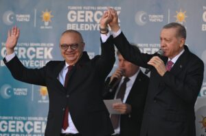 President Recep Tayyip Erdoğan greets the public with mayoral candidate Cengiz Ergün (L), Manisa, western Türkiye, Feb. 27, 2024. (AA Photo)