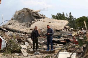 Men check the site of an Israeli airstrike that targeted a house in the village of Jibshit, southern Lebanon, Feb. 27, 2024. (AFP Photo)