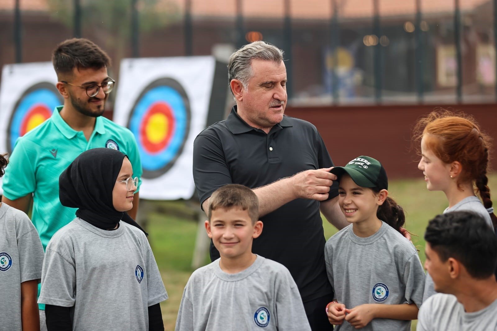 Youth and Sports Minister Osman Aşkın Bak (C) with children at the "First Step into Sport" project, Ankara, Türkiye, Feb. 28, 2024. (IHA Photo)