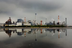 A petrochemical plant is reflected in a puddle at an industrial complex in Kawasaki near Tokyo, Japan, Aug. 31, 2015. (Reuters Photo)