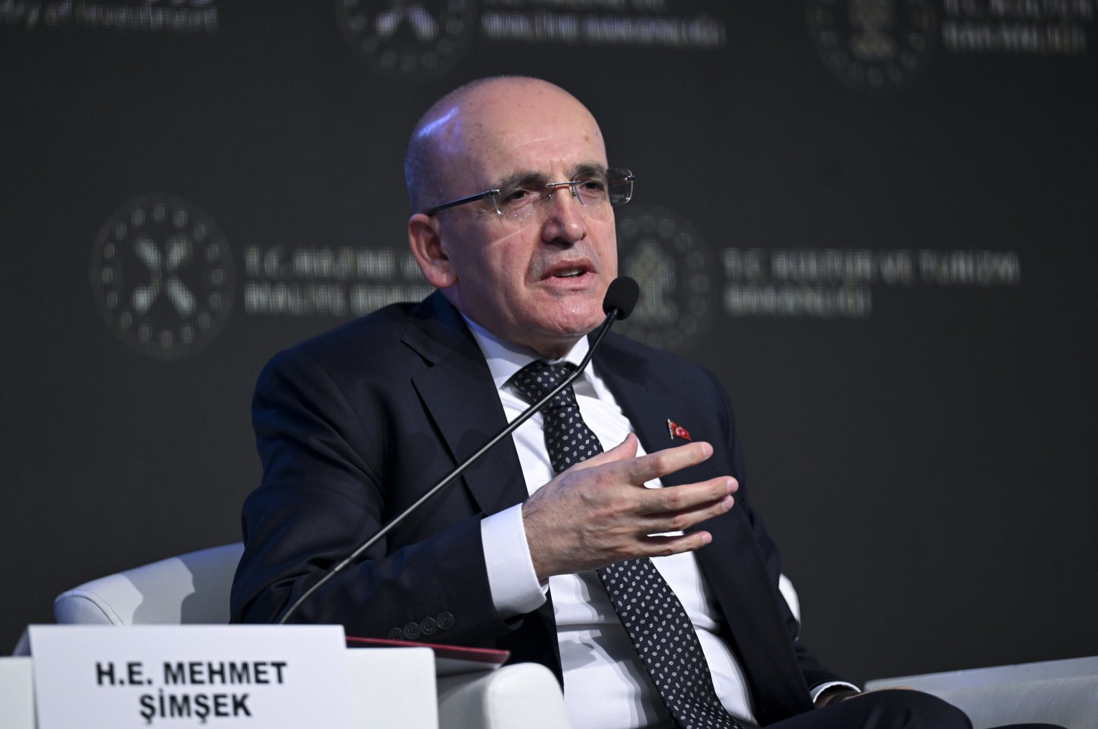 Treasury and Finance Minister Mehmet Şimşek delivers a speech during a business forum in Istanbul, Türkiye, Feb. 16, 2024. (AA Photo)