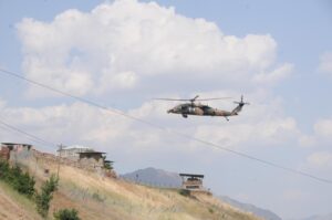 A Turkish Armed Forces (TSK) helicopter runs announcements for terrorists to surrender over mountains in Türkiye's Hakkari province bordering northern Iraq, Türkiye, Oct. 30, 2022. (DHA Photo)