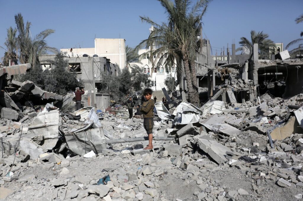 A child stands amid the ruins of a building destroyed in Israeli attacks, Deir el-Balah, Gaza, Palestine, March 3, 2024. (AA Photo)