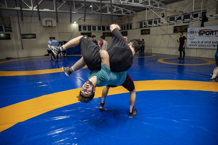 317818 Turkish wrestler Muhammet Ali Göçmen lifts his sparring partner during a training session at the Sakarya Municipality Sports Club, Sakarya, Türkiye, March 3, 2024. (AA Photo)