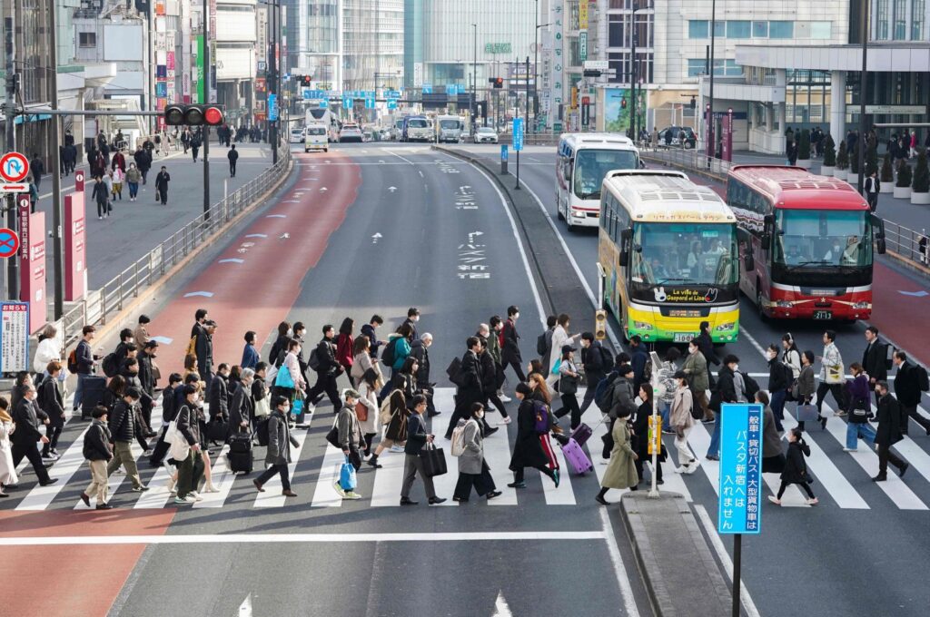 People commuting to work in the morning cross a pedestrian crossing, Tokyo, Japan, Feb. 15, 2024. (AFP Photo)