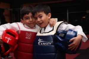 Taekwondo youngsters Muhammet Murat Yıldırım (L) and Miraç Mustafa Önek pose for a photo after training, Erzurum, Türkiye, March 4, 2024. (AA Photo)