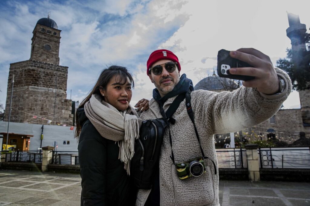 Tourists are photographed clicking photos in Antalya, southern Türkiye, March 5, 2024. (IHA Photo)