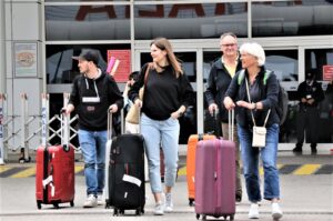 Tourists exit an airport in the Mediterranean tourism hot spot Antalya, southern Türkiye, May 1, 2023. (IHA Photo)