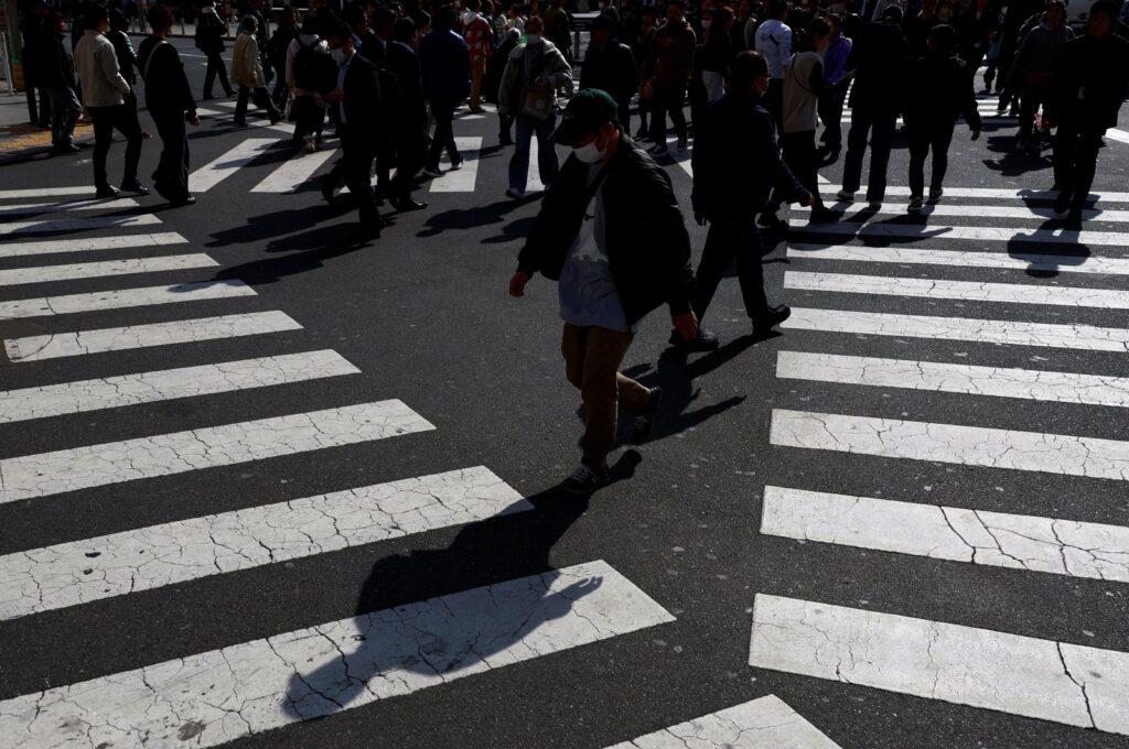 Passersby walk on a street in Tokyo, Japan Feb. 15, 2024. (Reuters File Photo)