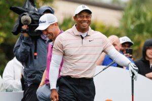 Tiger Woods laughs at a comment made by playing competitor Justin Thomas on the sixth tee box during the PNC Championship at The Ritz-Carlton Golf Club, Florida, U.S., Dec. 16, 2023. (Reuters Photo)